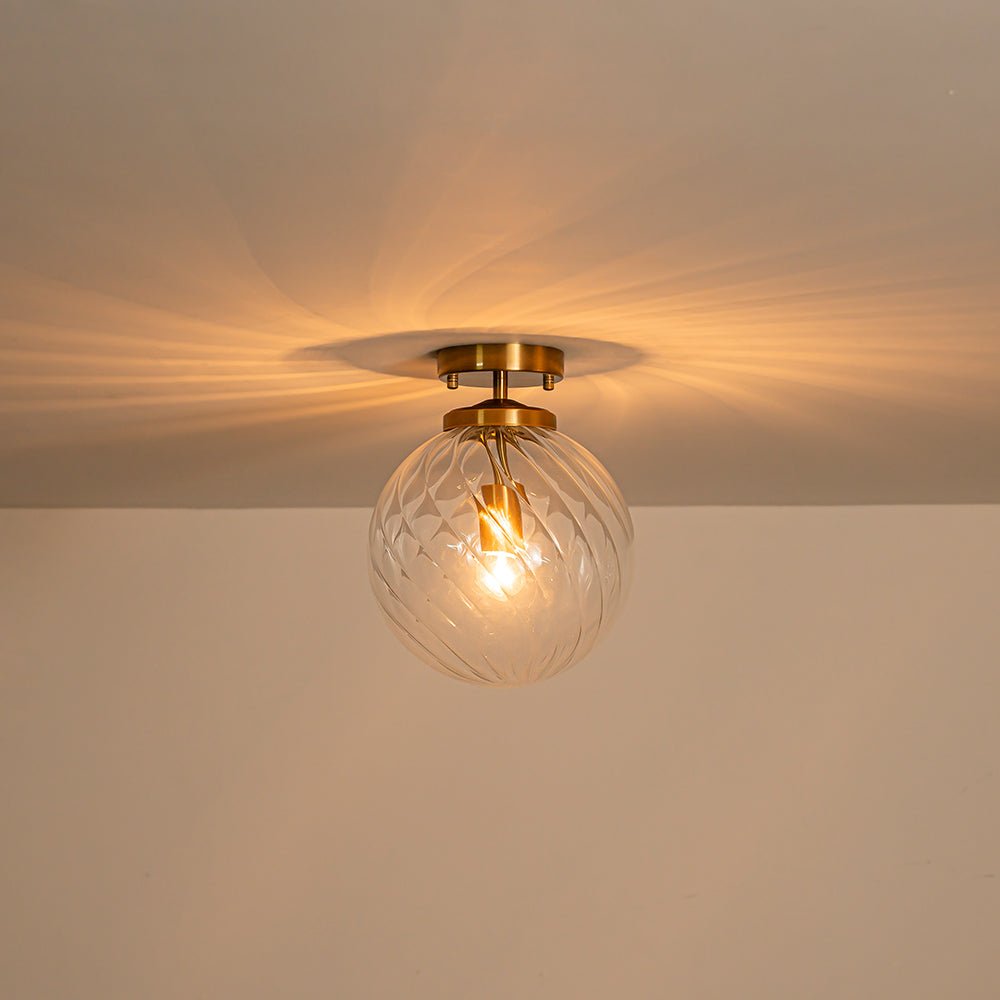 Brass 1-Light Swirling Ribbed Glass Globe Semi Flush Mount
